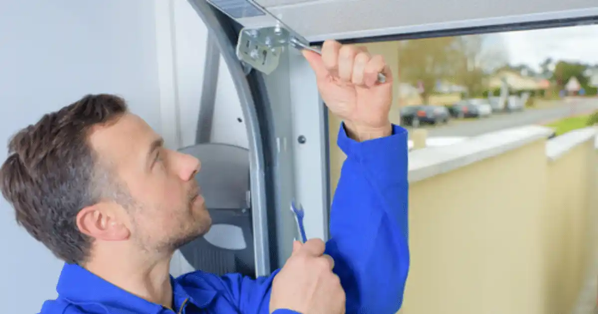person maintaining a garage door