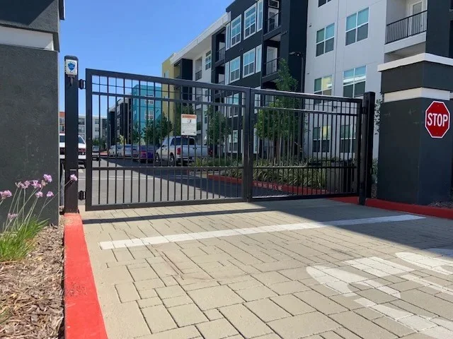 the perimeter security and automated access control solutions provided by a heavy-duty automatic swing gate in Pflugerville, TX
