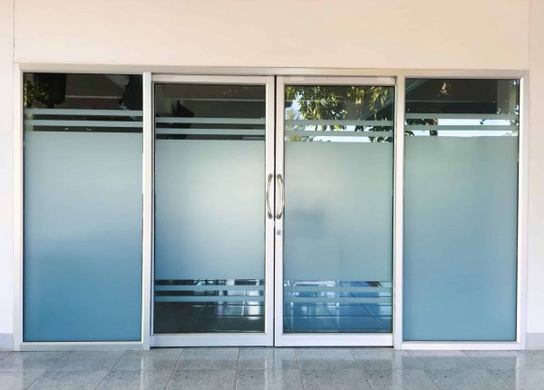 Glassdoors of the meeting room in the first floor of the school